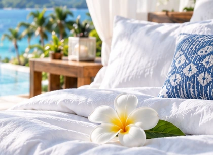 Fresh linen and a frangipani beside the sea